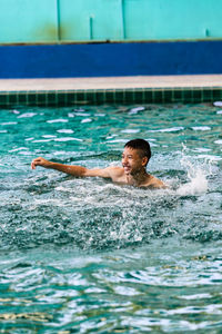 Man swimming in pool