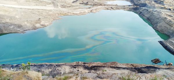 High angle view of lake amidst rock formation