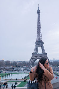 Woman in front of  eiffel tower...