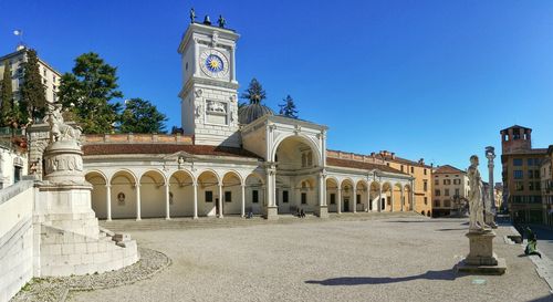 Low angle view of building against clear blue sky