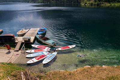 High angle view of boats moored on shore