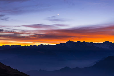 Scenic view of mountains at sunset