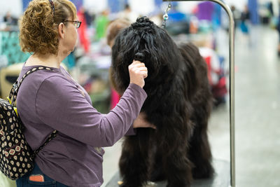 Rear view of woman with dog