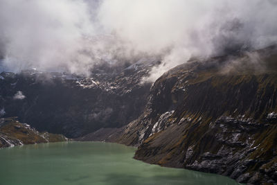 Scenic view of mountain lake against sky