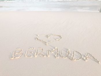 Text written on sand at beach