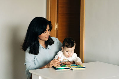 Mother and son on table at home