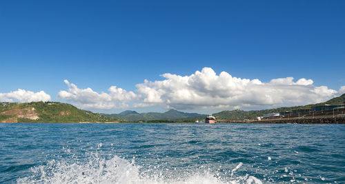 Scenic view of river against blue sky