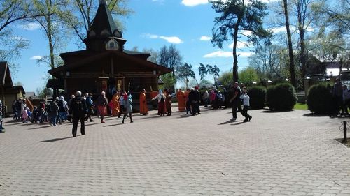 People at town square against sky