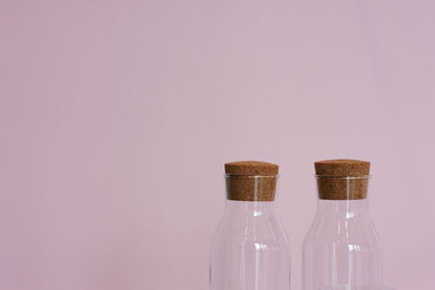 Close-up of glass bottle against white background