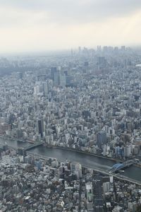 Aerial view of cityscape against sky