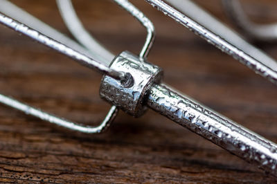 Close-up of metallic structure on table