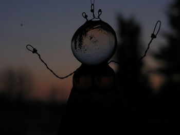 Close-up of silhouette stained glass with sunset