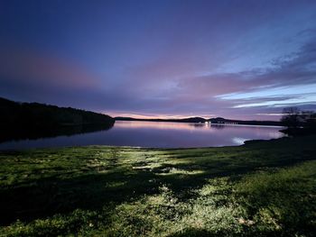 Scenic view of lake against sky during sunset