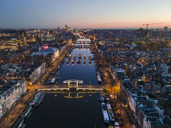 High angle view of city buildings during sunset in amsterdam