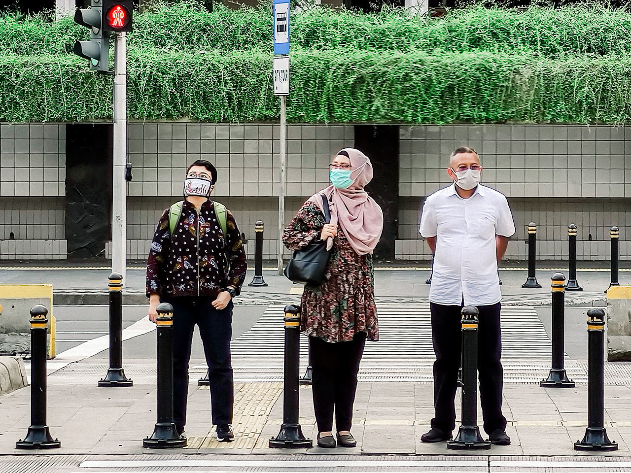 group of people, full length, adult, men, architecture, person, clothing, city, road, young adult, standing, street, footwear, day, women, outdoors, togetherness, building exterior, small group of people, built structure