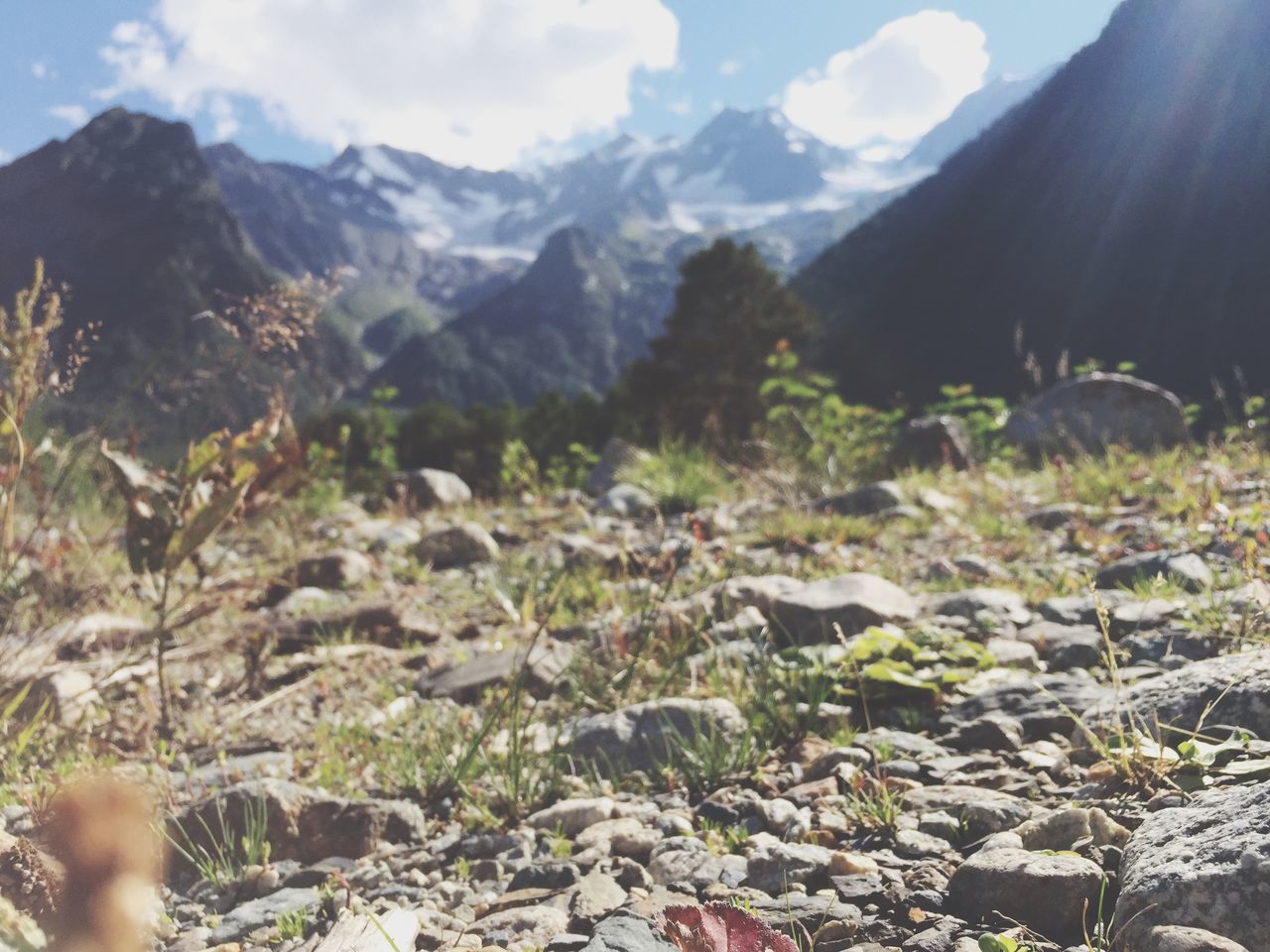 mountain, mountain range, tranquil scene, tranquility, scenics, beauty in nature, rock - object, sky, nature, landscape, non-urban scene, idyllic, rock formation, remote, day, rocky mountains, sunlight, outdoors, valley, rock