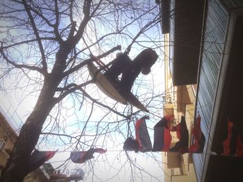 Low angle view of people against sky