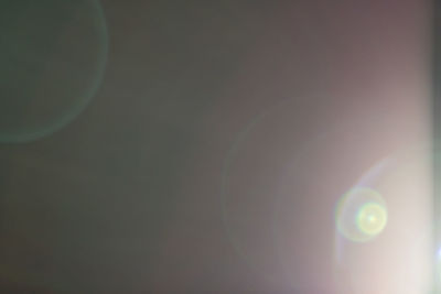Defocused image of moon against sky
