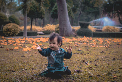 Portrait of boy playing in park