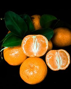 Close-up of oranges against black background