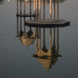 Reflection of built structure in puddle