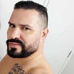 Close-up portrait of young man against wall