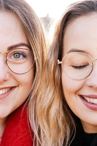 Close-up portrait of a smiling young woman