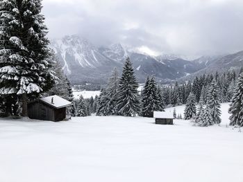 Snow covered landscape against sky