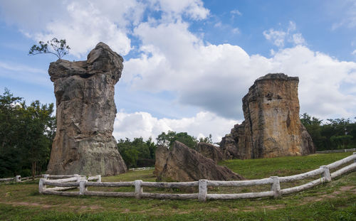 Stone structure on field against sky