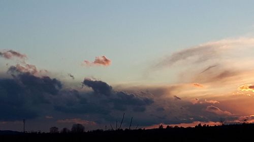 Low angle view of silhouette landscape against sky during sunset