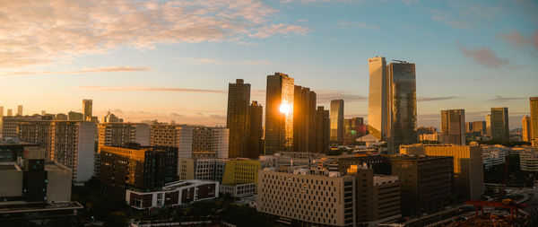 Cityscape against sky during sunset