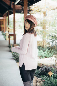 Portrait of woman standing outdoors