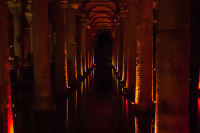 View of illuminated corridor of temple