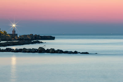 Scenic view of sea at dusk