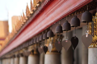 Close-up of lanterns hanging in building