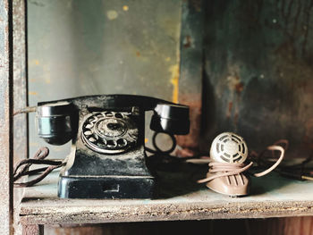 Close-up of old telephone on table