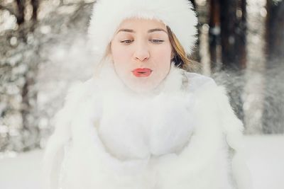 Portrait of a young woman in snow