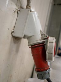 Close-up of pipes against white wall