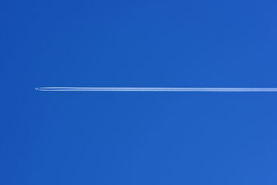 Low angle view of airplane flying in sky