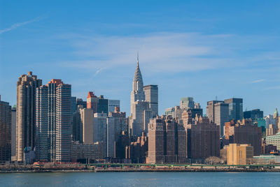 Modern buildings in city against sky