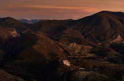 Scenic view of mountains against sky during sunset