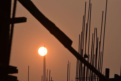 Low angle view of illuminated street light against sky during sunset