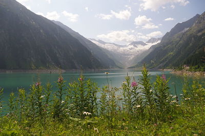 Scenic view of lake and mountains against sky