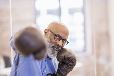 Portrait of businessman with boxing gloves