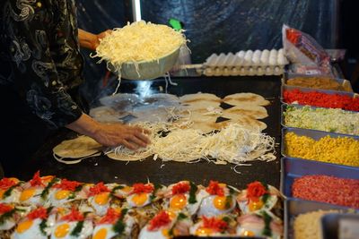 Chef preparing pancakes on griddle