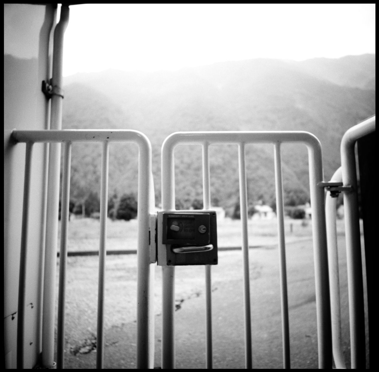 METAL RAILING AGAINST MOUNTAINS