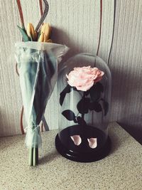 Close-up of flower vase on table at home