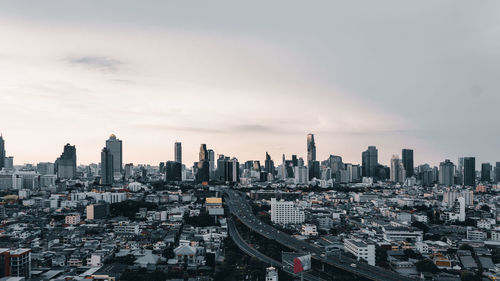 High angle view of modern buildings in city against sky