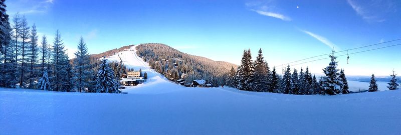 Snow covered landscape against sky