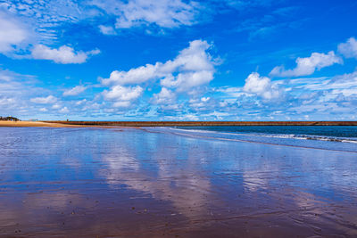 Scenic view of sea against blue sky